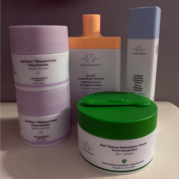 Drunk Elephant Skincare Collection with Orange Green and Purple Accents